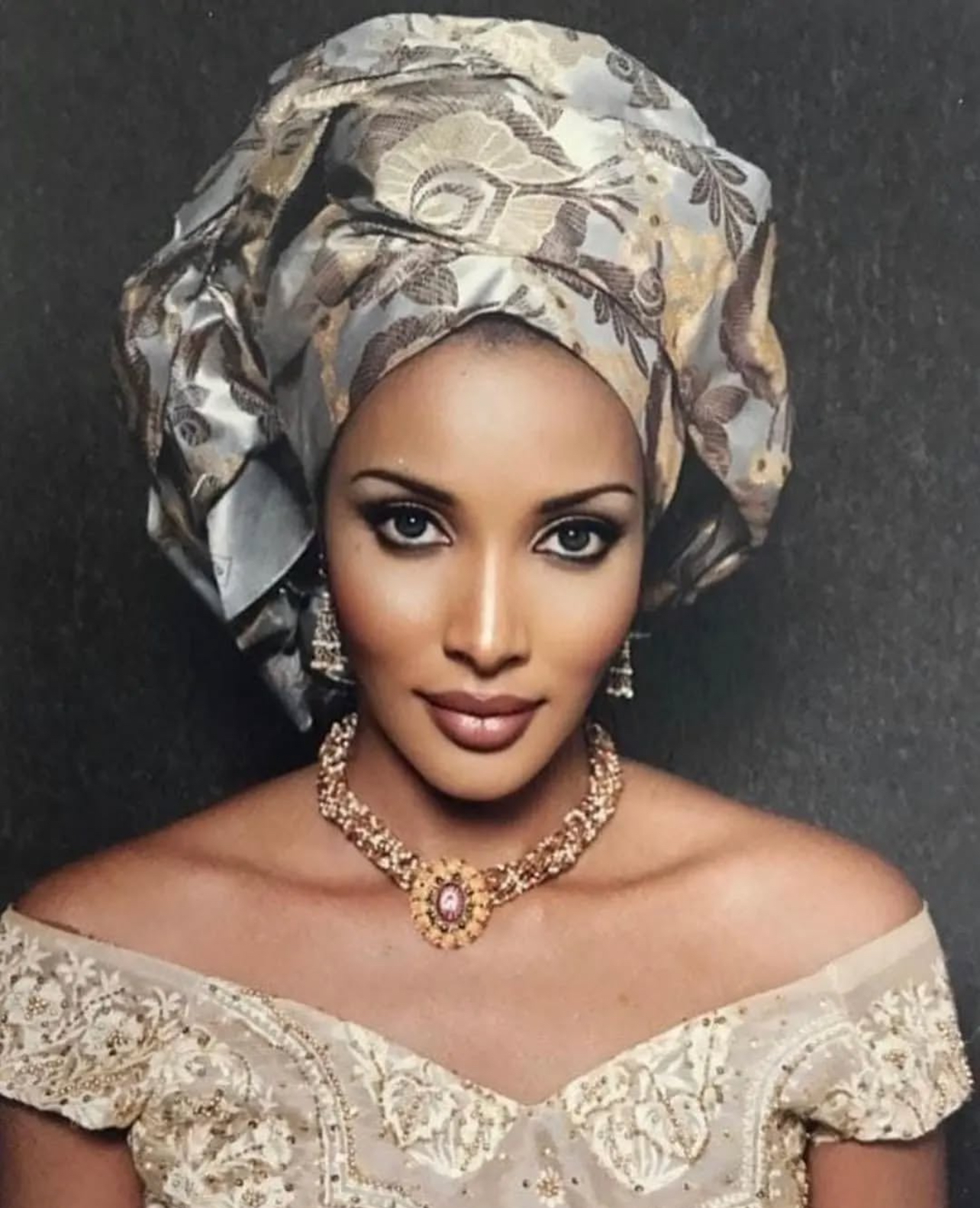 Bianca Odumegwu Ojukwu wearing an elaborate architectural Ichafu characterized by stiffened fabric or damask, gathered volume and structural height and silhouette styled for a formal occasion.