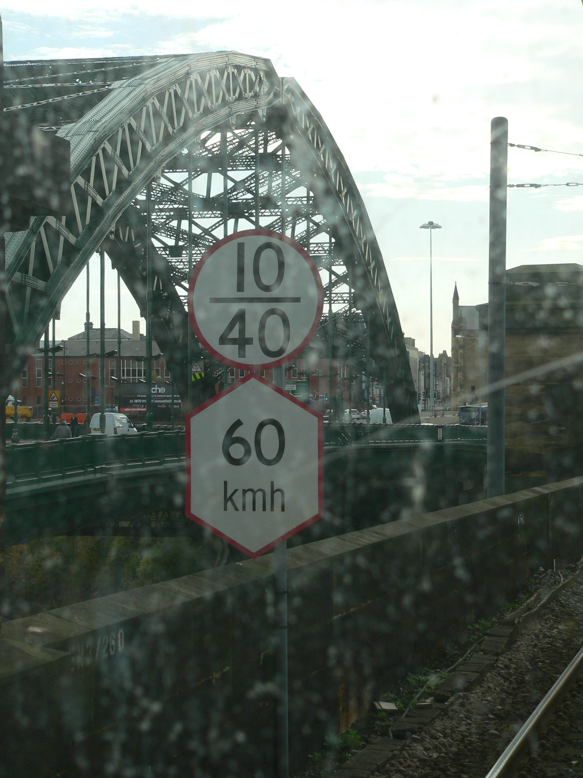 Speed restrictions in km/h for the Tyne and Wear Metro (hexagonal sign) below mainline speed restriction signs in mph (round signs).