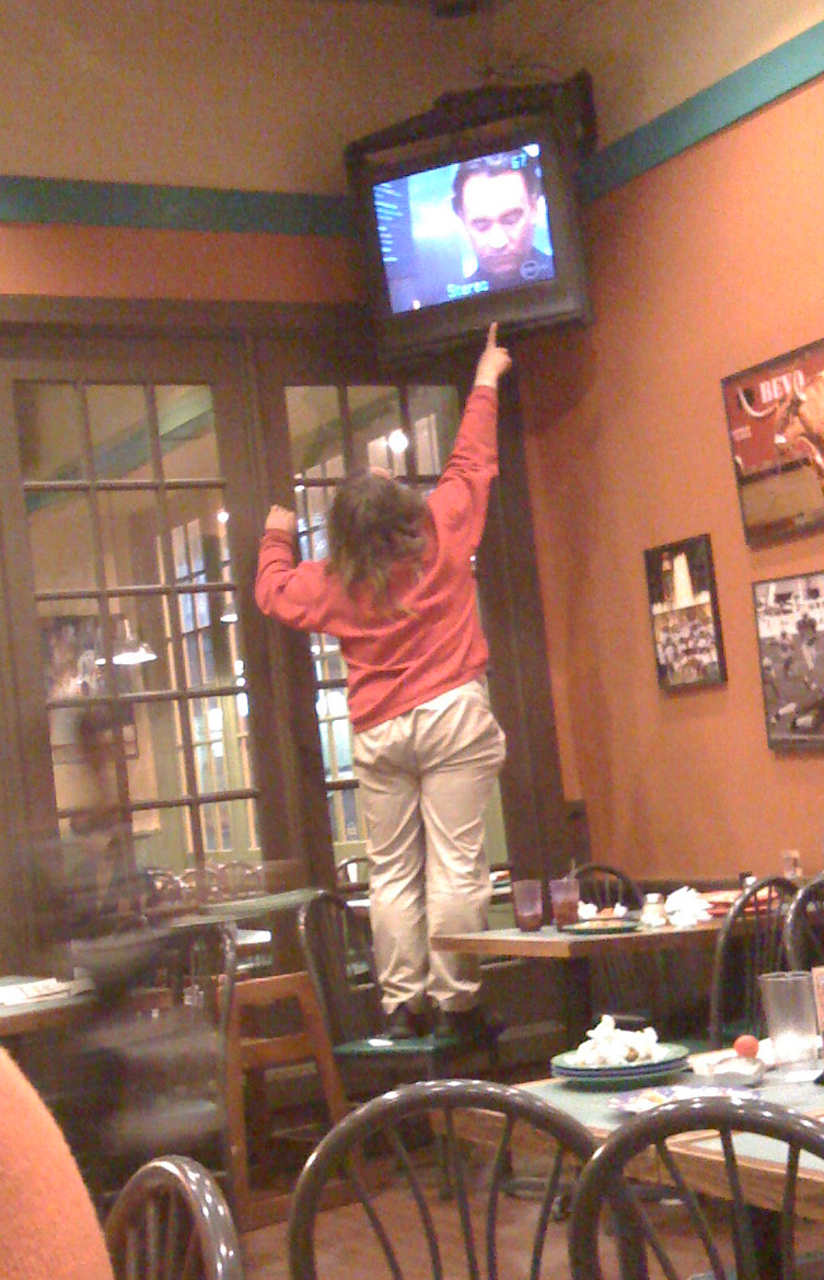 Jennifer Gale changes the channel at Gatti's Pizza, an eatery she frequented, near the University of Texas at Austin.