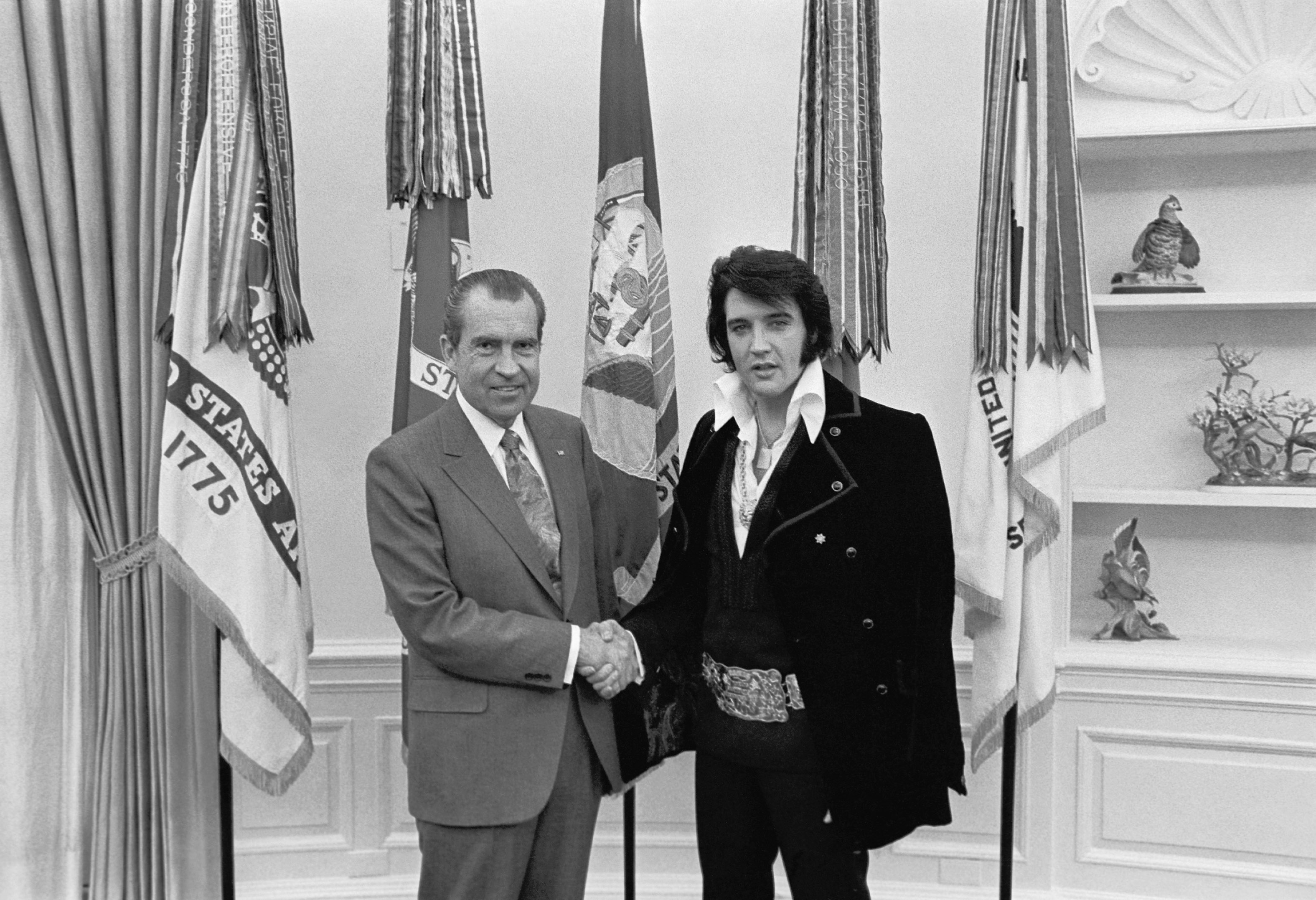 President Richard Nixon and Elvis Presley December, 1970. This image has appeared on t-shirts with the message "We're Dead" on the front and the message "Really, Really Dead" on the back.