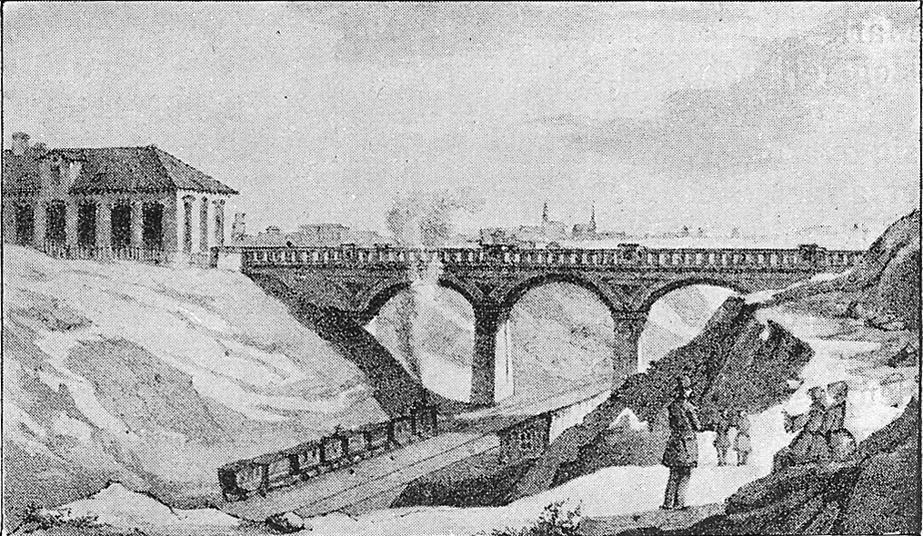 The old railway bridge in Valby. A narrow gauge train under the railway bridge