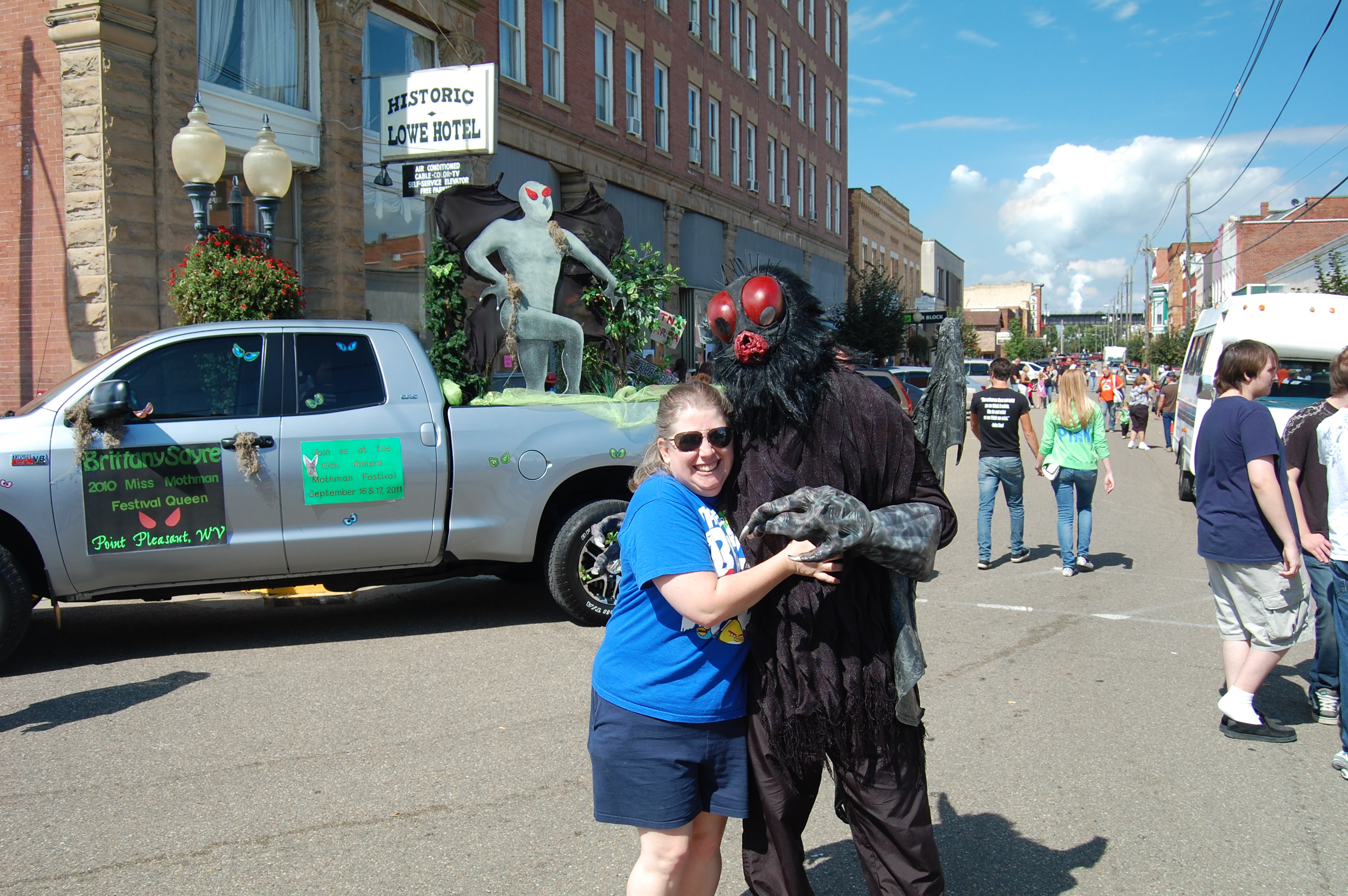 Photo from the 2011 Annual Mothman Festival, showing a Mothman cosplayer and other festivities.