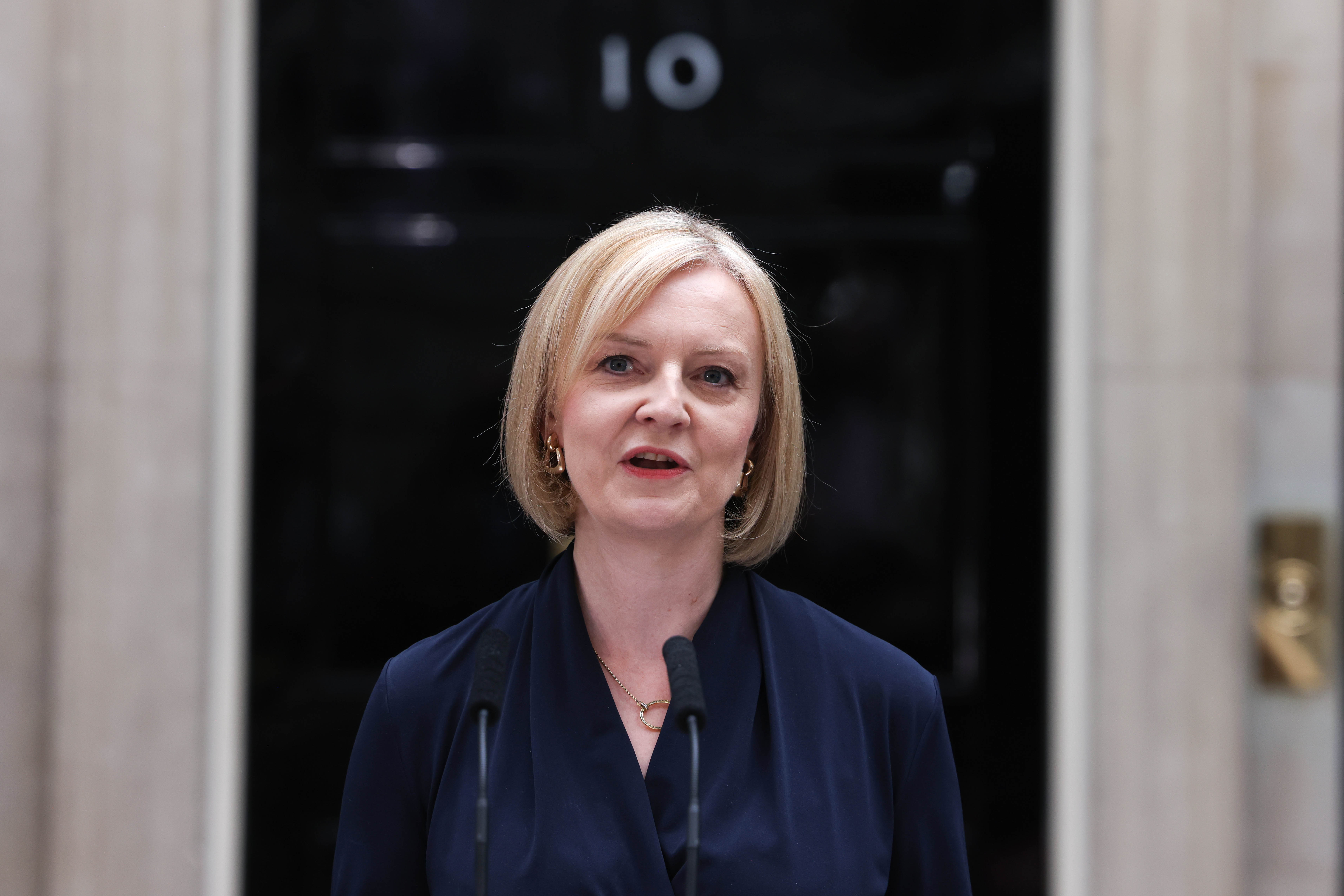 Liz Truss delivering her first speech as prime minister on 6 September 2022|alt=refer to caption