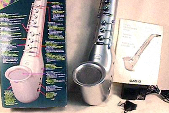 The Casio DH-100, with packaging and user manual.|right