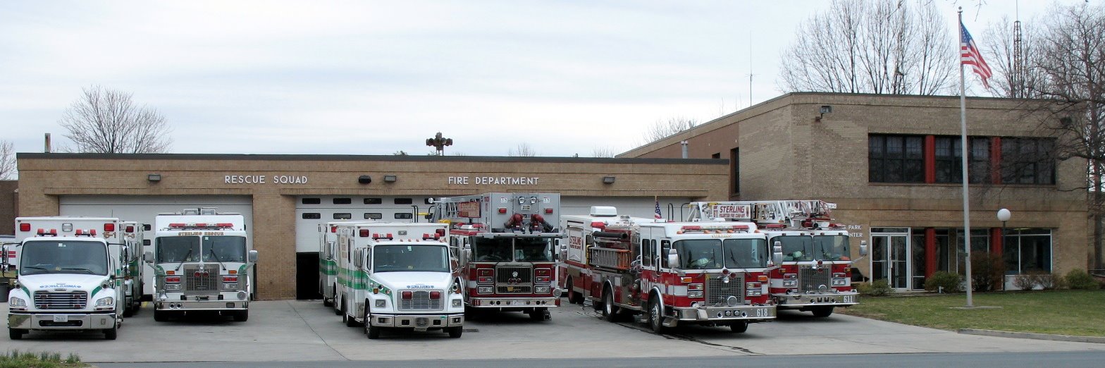 Station 15/11. From left: Sterling Rescue apparatus, Tower 11, Wagon 11, and Quint 11.