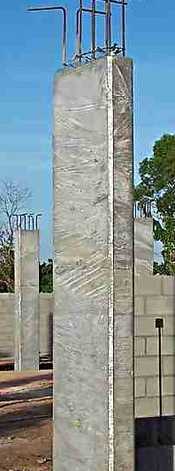 Concrete columns curing while wrapped in plastic Concrete columns curing while wrapped in plastic