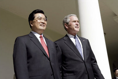 President George W. Bush and Chinese President Hu look out over the Rose Garden after meeting in the Oval Office Thursday, April 20, 2006.
