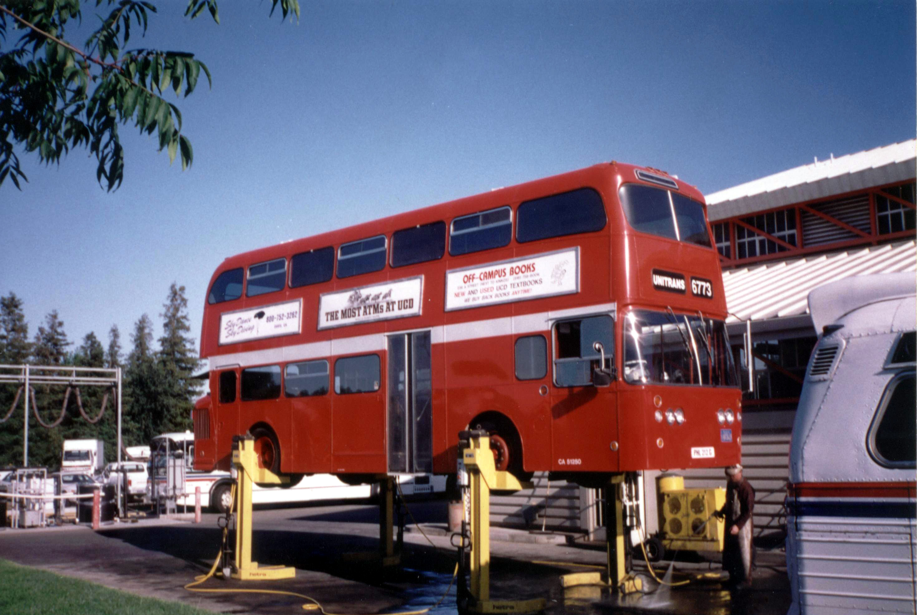 Unitrans 6773 at the Unitrans garage having its underbody cleaned (photo taken in the early-mid 1990's)