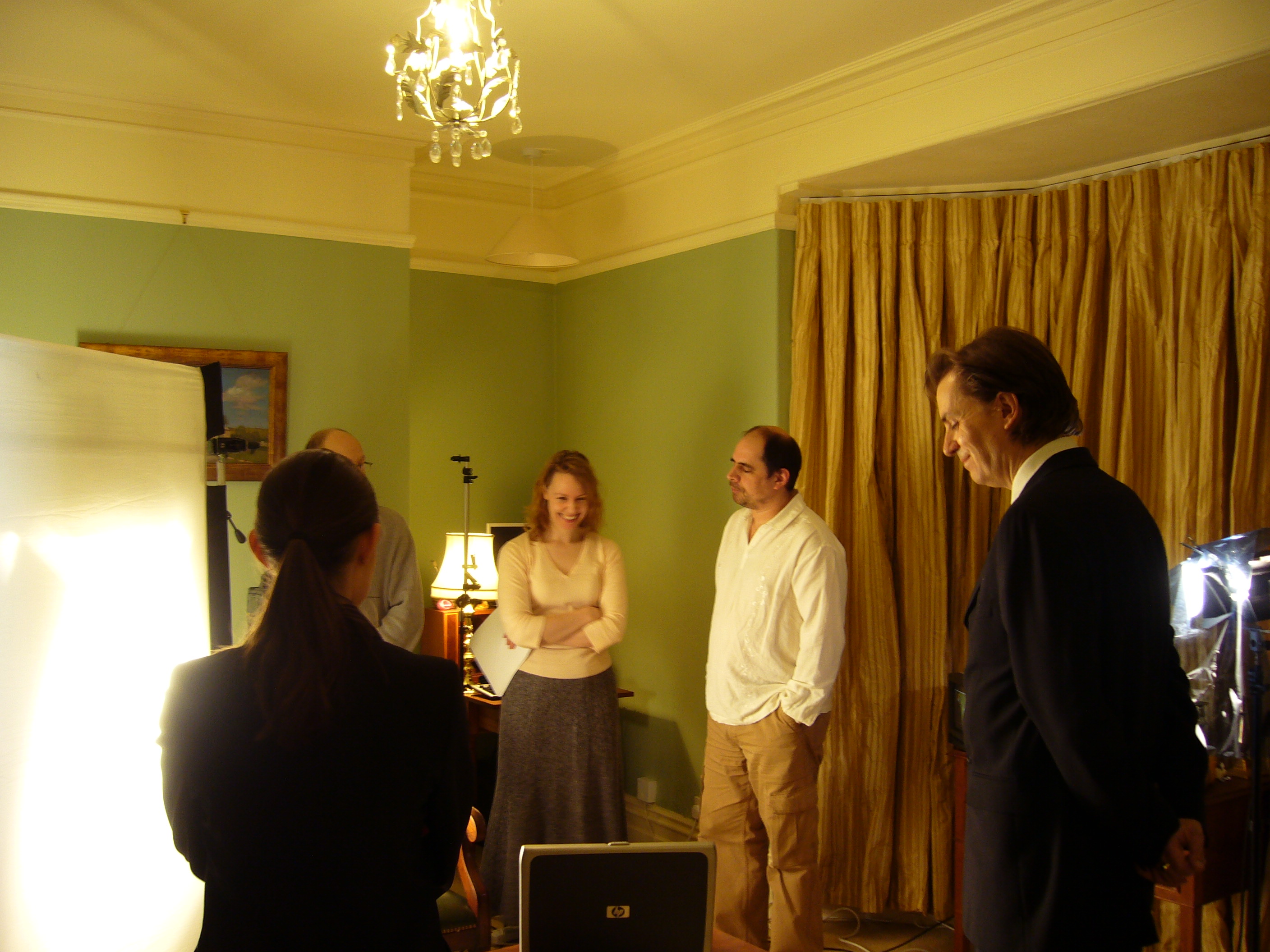 Jennifer Belander reviews a scene with cast and crew