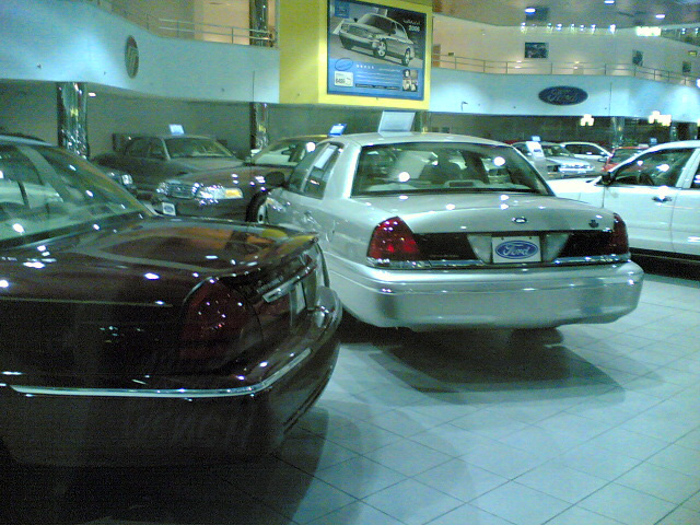 A 2005 Ford Crown Victoria Standard and Mercury Grand Marquis LS at AMG's Shuwaikh showroom in January 2006.