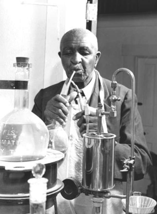 George Washington Carver at work in his laboratory at Tuskegee Institute. Much of the groundwork associated with Cooperative Extension work in Alabama and throughout the nation was laid by Carver and by Booker T. Washington, Tuskegee's founder.