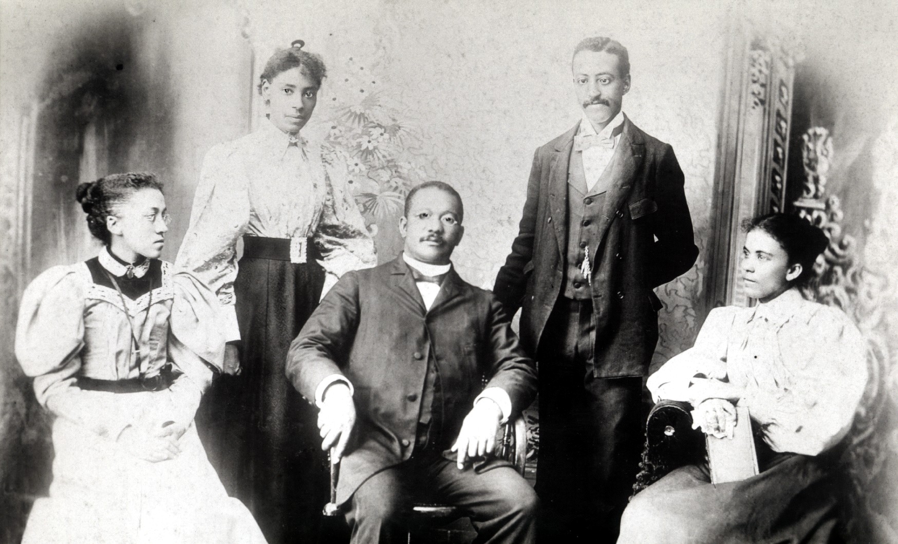 William Hooper Councill (center), lawyer, editor and founder of Huntsville Normal School (later Alabama A&M University), posing with some of his students.