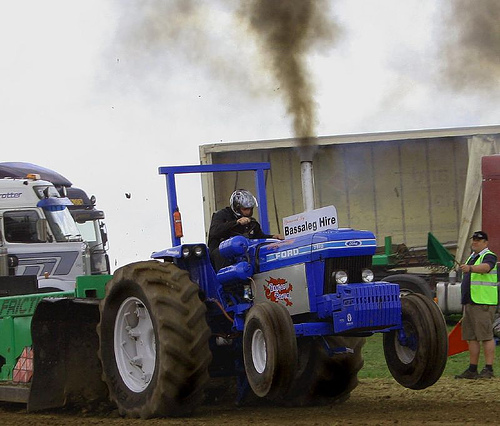A Ford tractor pulling. A Ford tractor pulling.