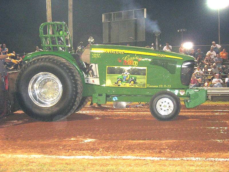 A John Deere pulling tractor. A John Deere pulling tractor.