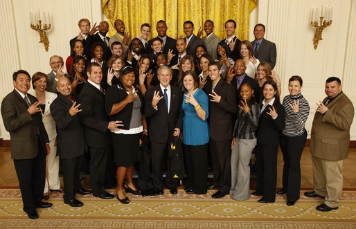 Former president George W. Bush making the "pitchfork" gesture during a visit to the White House by the Arizona State track and field team. Former president George W. Bush making the "pitchfork" gesture during a visit to the White House by the Arizona State track and field team.