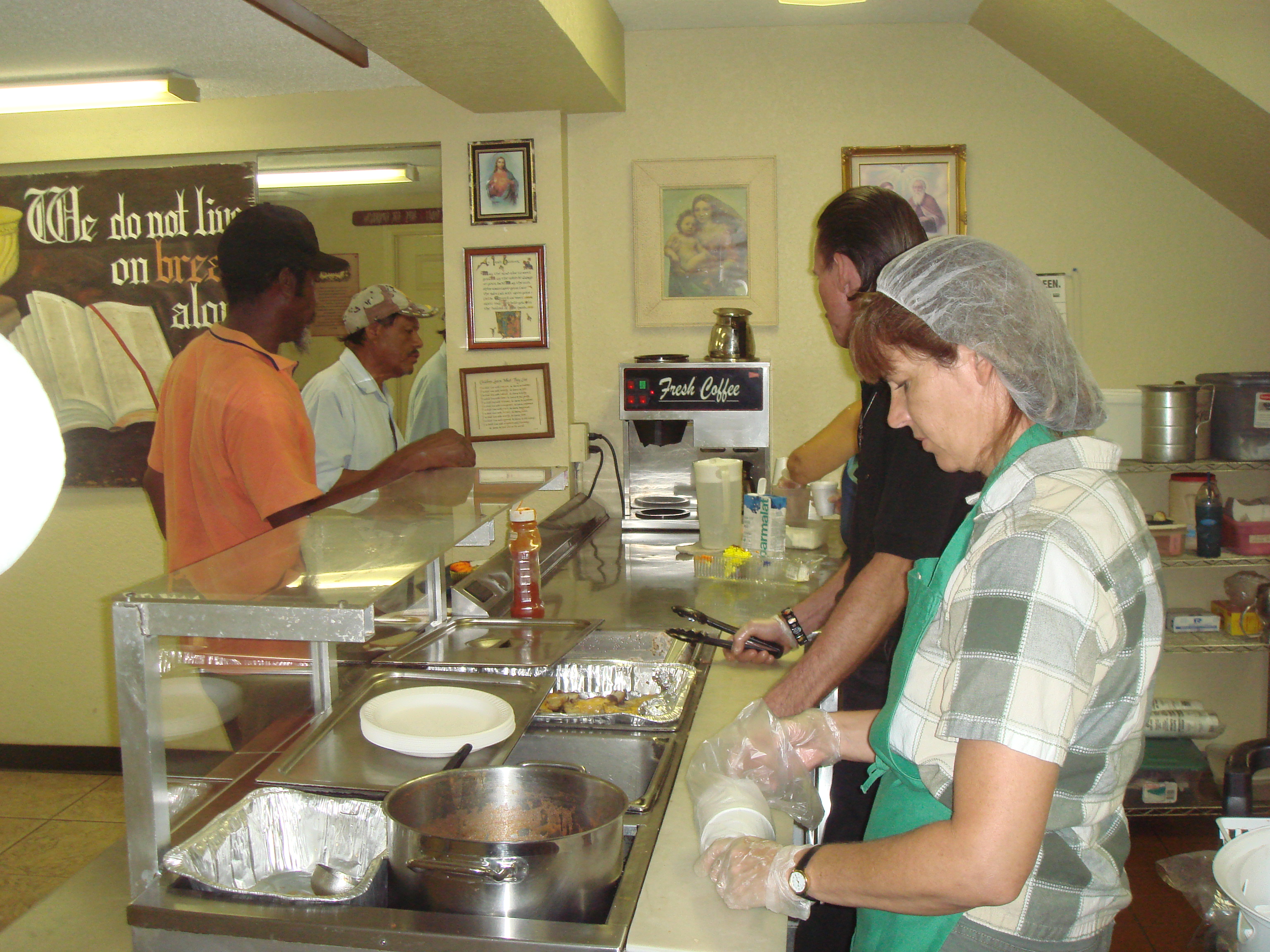 Volunteers and patrons finishing the lunch line.