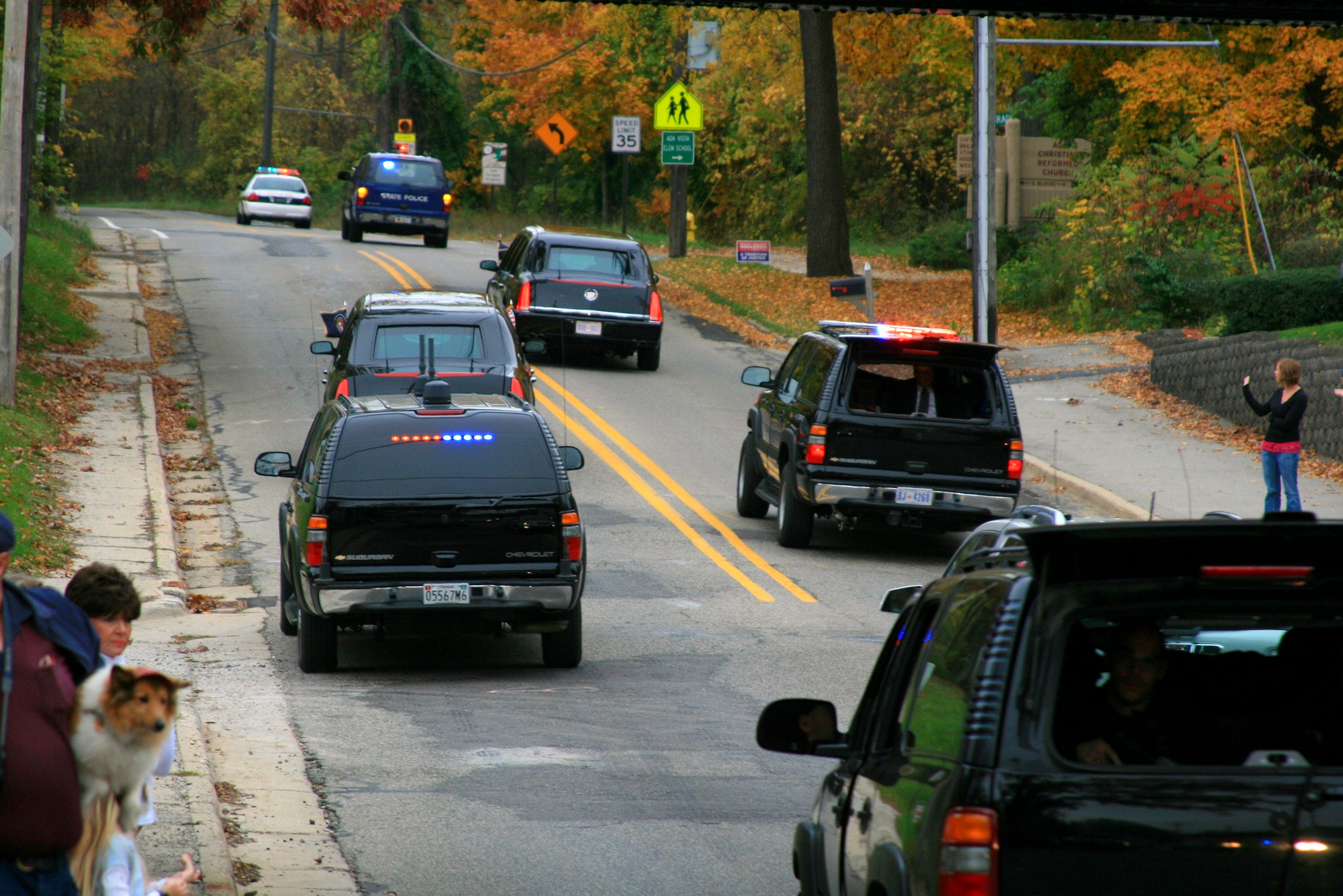 Rear view of presidential motorcade. ECM suburban is on the left