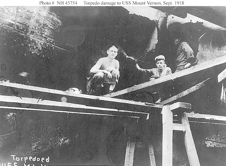 Torpedo damage to USS Mount Vernon's hull at a naval yard, in Brest, France in 1918.