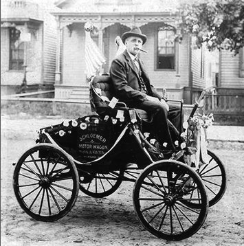Schloemer and his automobile in 1895 floral parade