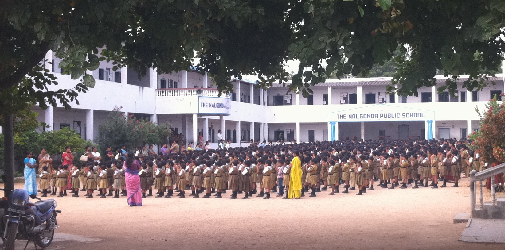 |Students of Nalgonda Public School standing at morning assembly