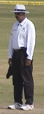 West Indies' Billy Doctrove has officiated the most number of IPL matches, with only one match ahead of Australia's Simon Taufel.|alt=A dark skinned man standing, wearing white shirt, shoes and hat, along with a black pant and sunglasses. A cricket field and the boundary ropes can be seen in the background.