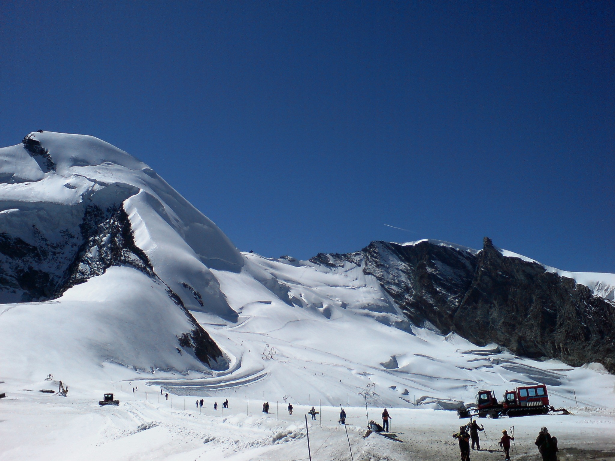 The slopes in the Saas Fee area in which the ski sequences were shot.|alt=A view of mountain slopes, heavily laden with snow.