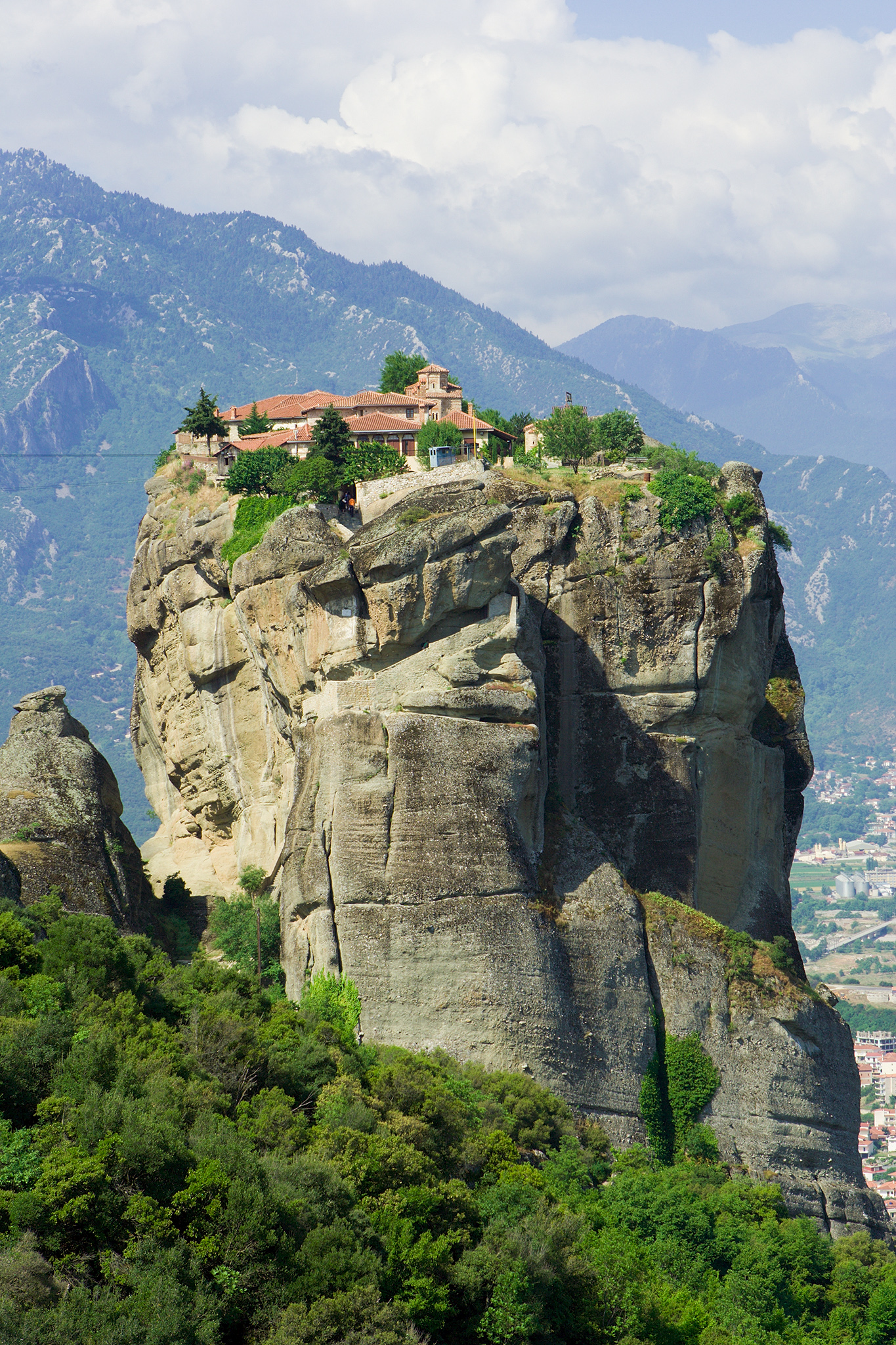 The Monastery of the Holy Trinity in Meteora served as a location|alt=A monastery stands atop a large mountain.