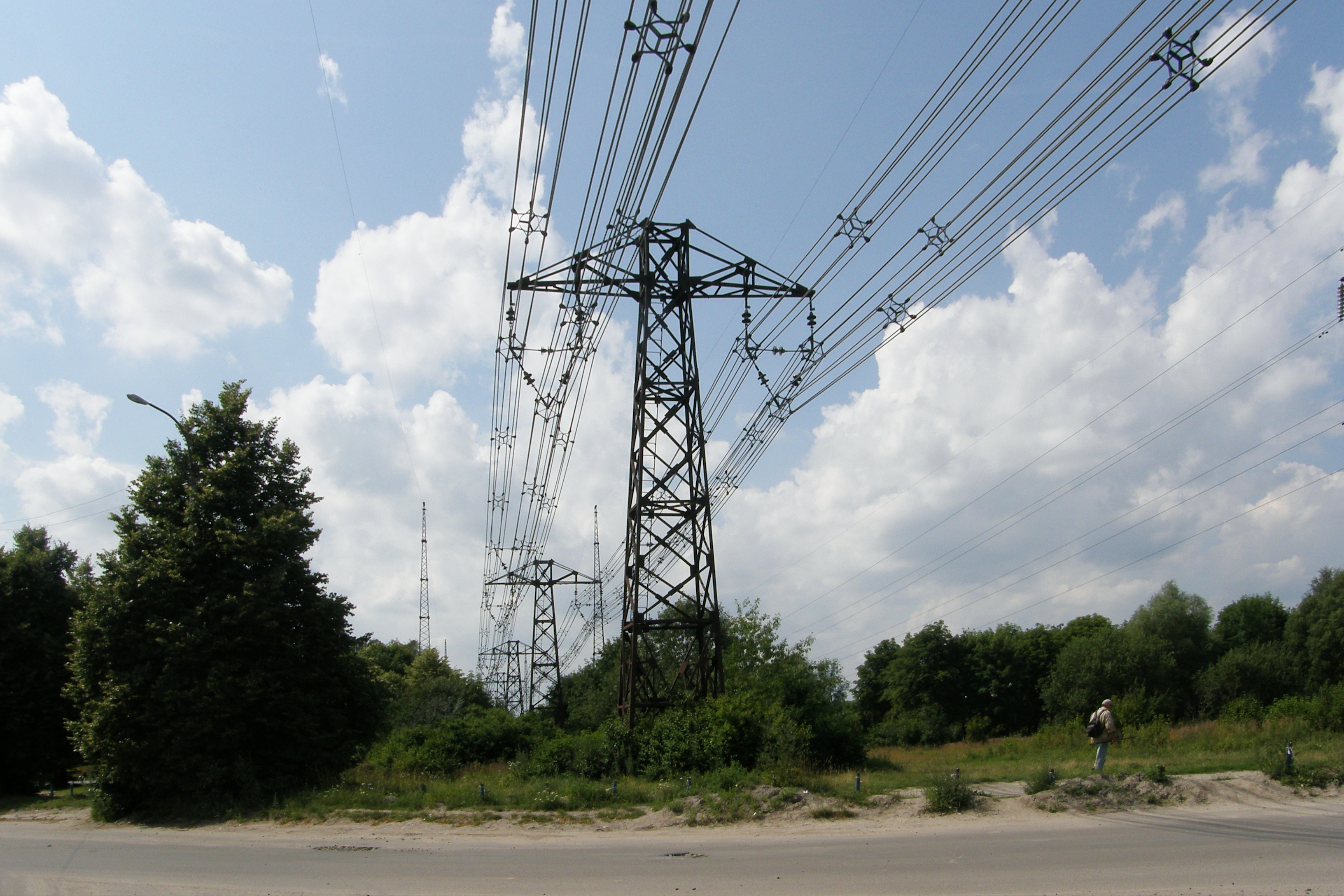 One of the line's spans crossing the road. A conventional higher-voltage line is seen to the right.