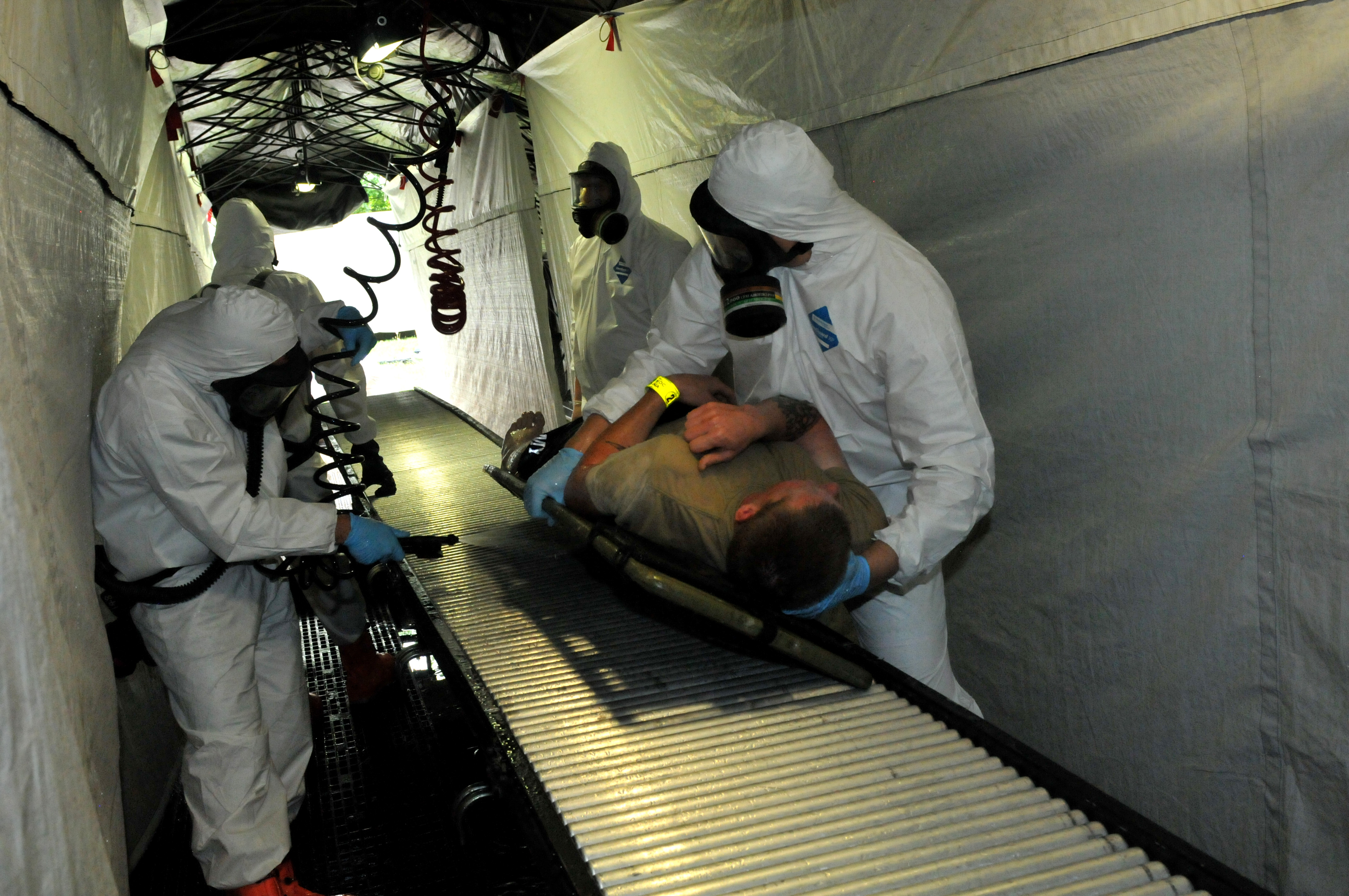 A team of Polish and American Soldiers practice decontamination procedures during a training exercise in Poland A team of Polish and American Soldiers practice decontamination procedures during a training exercise in Poland