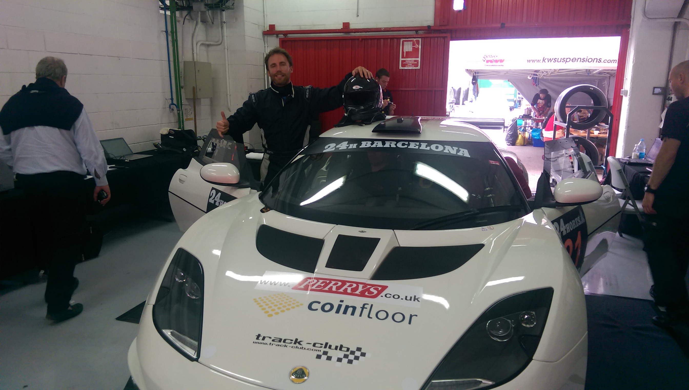Adam Knight, Coinfloor's Chairman and Lotus Exige V6 with Coinfloor's logo on the hood at the 24H BARCELONA race.