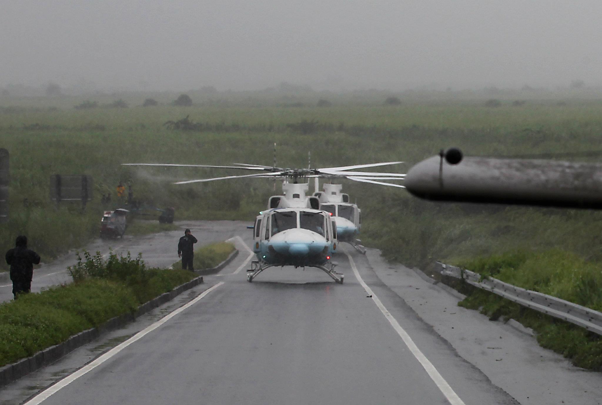 Presidential chopper were President Benigno S. Aquino III is on board makes an emergency landing at SCTEX near Hacienda Luisita in Tarlac due to poor visibility brought about by heavy rains Friday, August 10, 2012 .