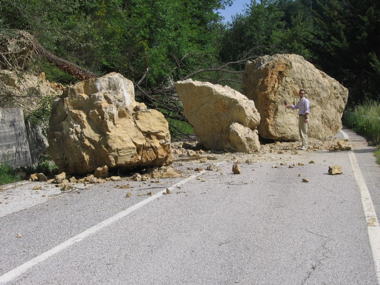 A rock fall disrupts a road|alt=A rock fall disrupts a road