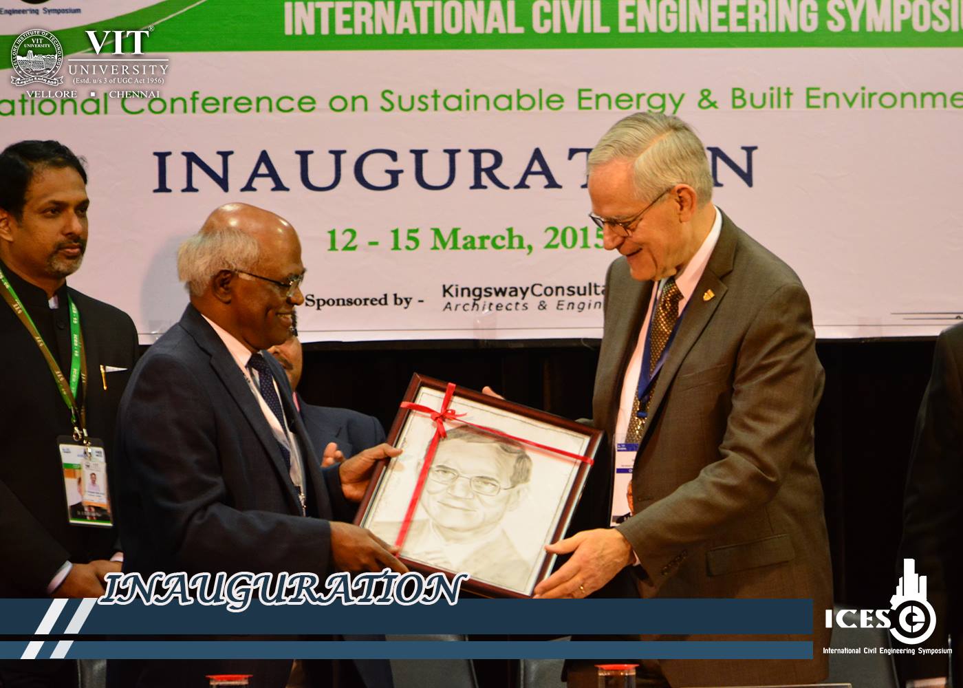 Dr. Robert Stevens receiving his portrait during Inaugural function of ICES' 15.