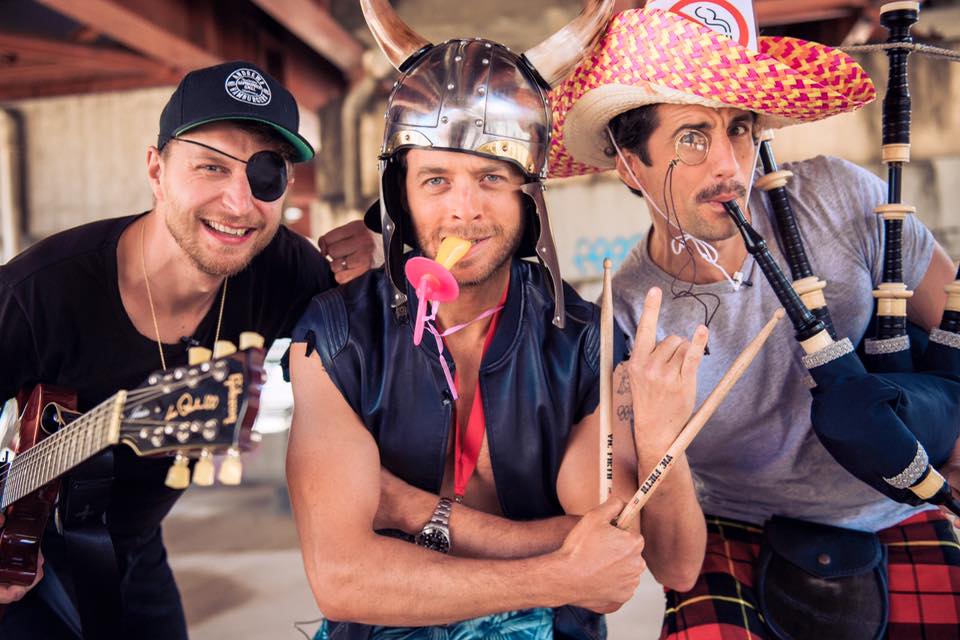 The band wearing their traditional outfits. (Jack Post, Hamish Blake, Andy Lee) 