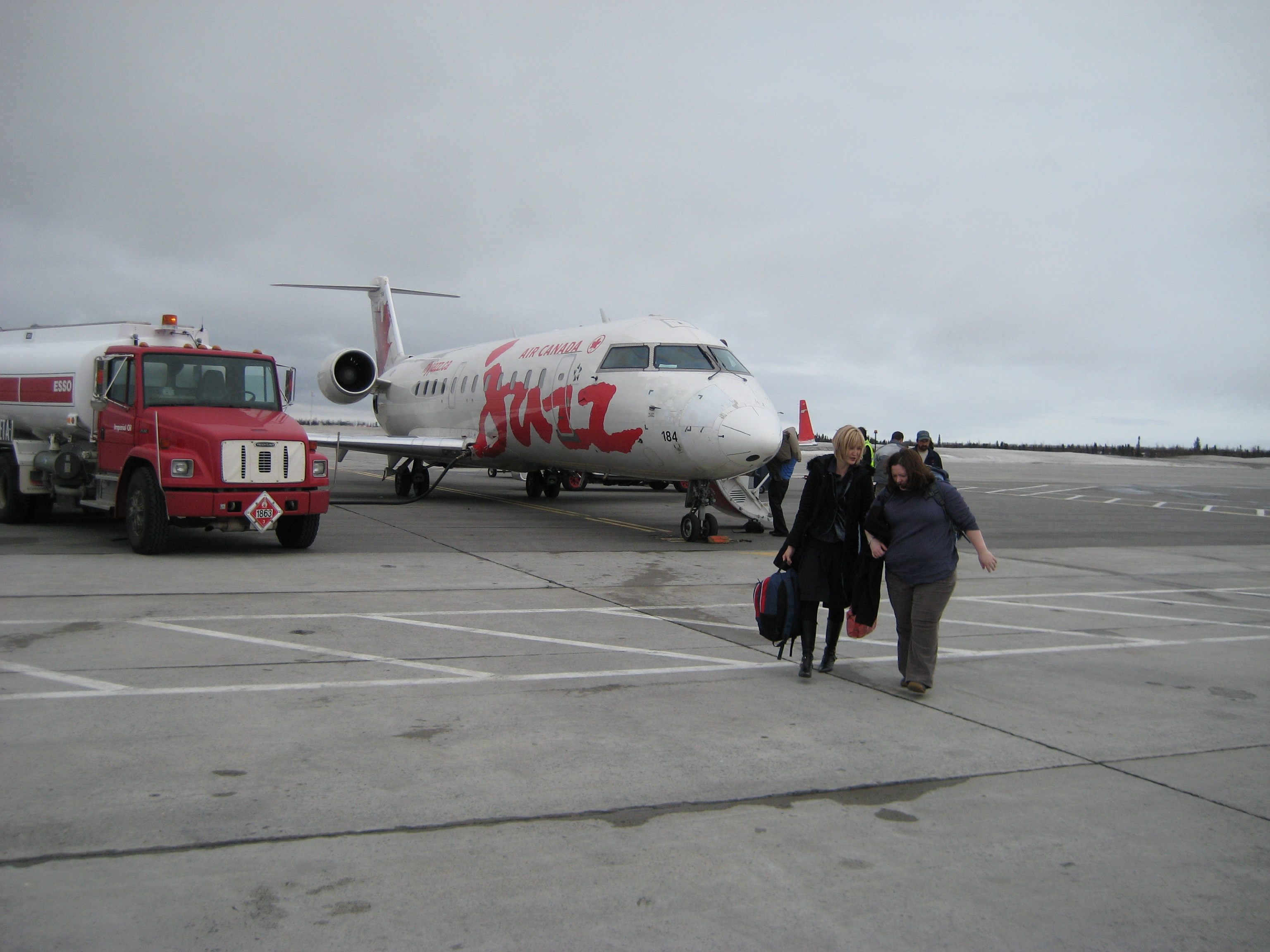Passengers walking towards the terminal after arriving in Happy Valley Goose Bay, one of the destinations of Air Canada Express