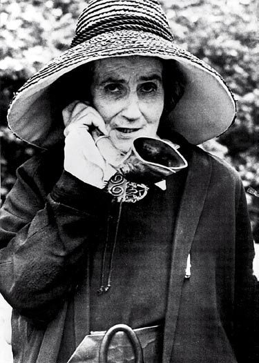 Madame de Meuron, a Swiss eccentric with her characteristic ear trumpet and hat.
