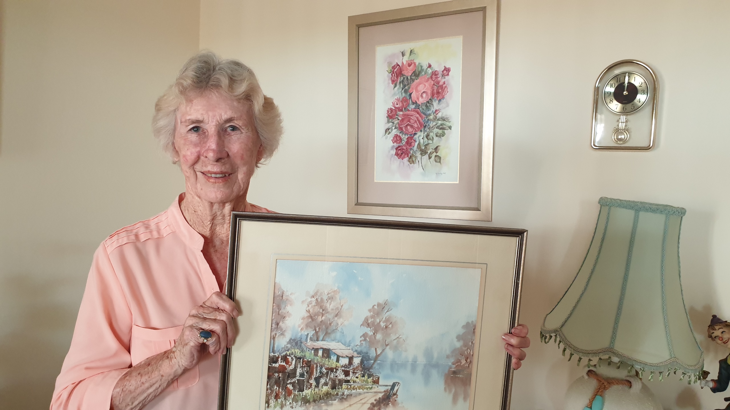 Artist May O'Neill holds one of her works|right Artist May O'Neill holds one of her works|right
