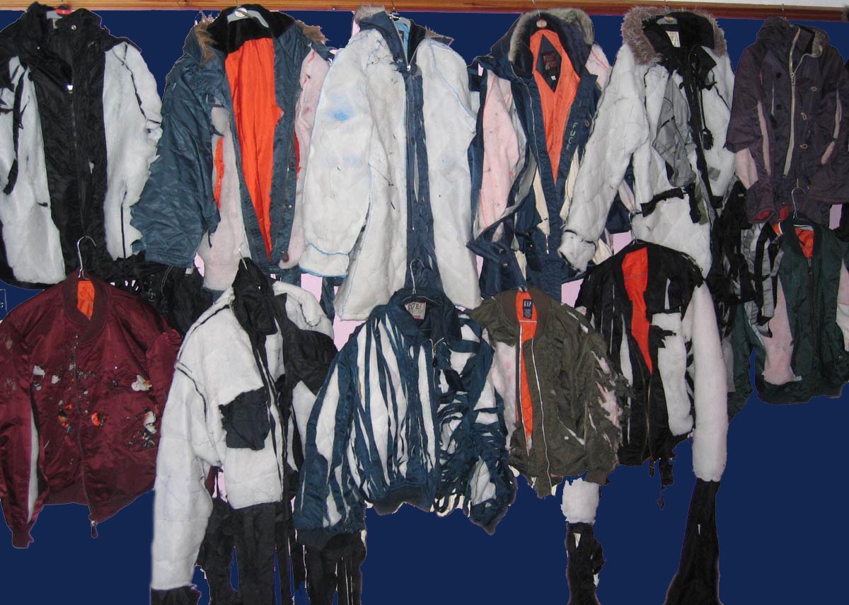 An array of slashed and ripped nylon jackets