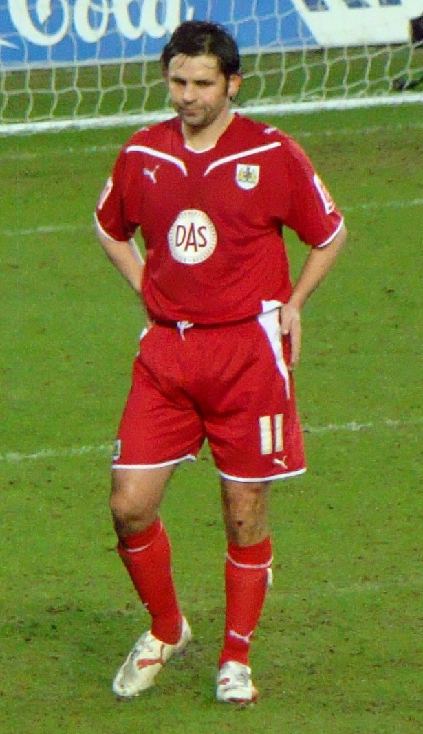 Paul Hartley scored a hat-trick for Hearts in an Edinburgh derby in the Scottish Cup.|alt=A man reacting to a goal