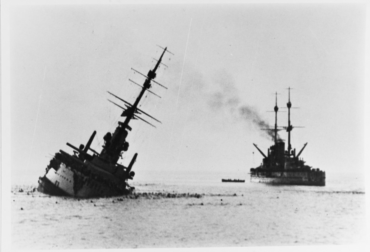 Szent István sinking in June 1918 after being struck by an Italian torpedo. Tegetthoff can be seen on the right|alt=A battleship lies low in the water with a heavy list after being struck by a torpedo. Another battleship can be seen floating