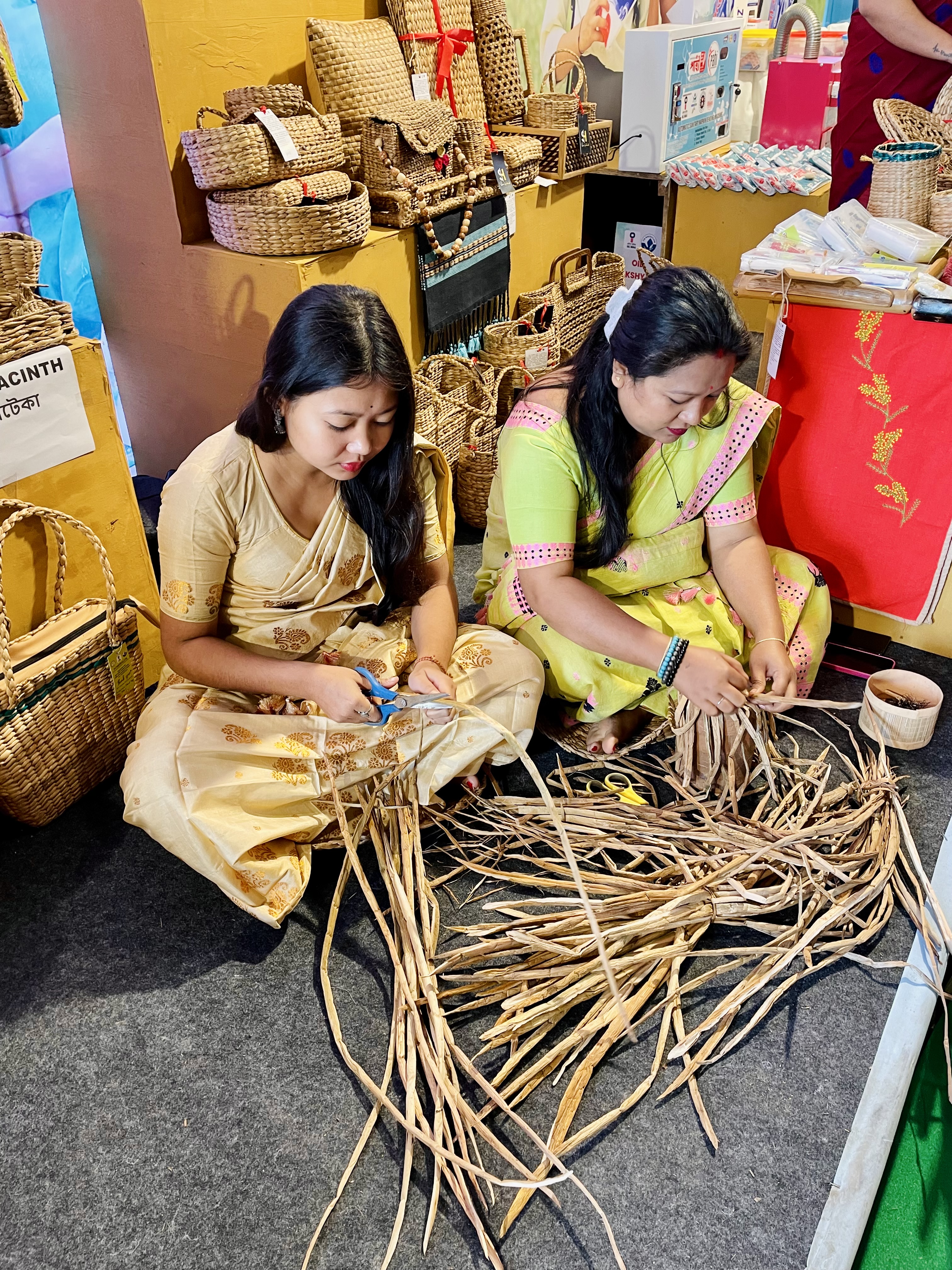 Women creating products from dried water hyacinth