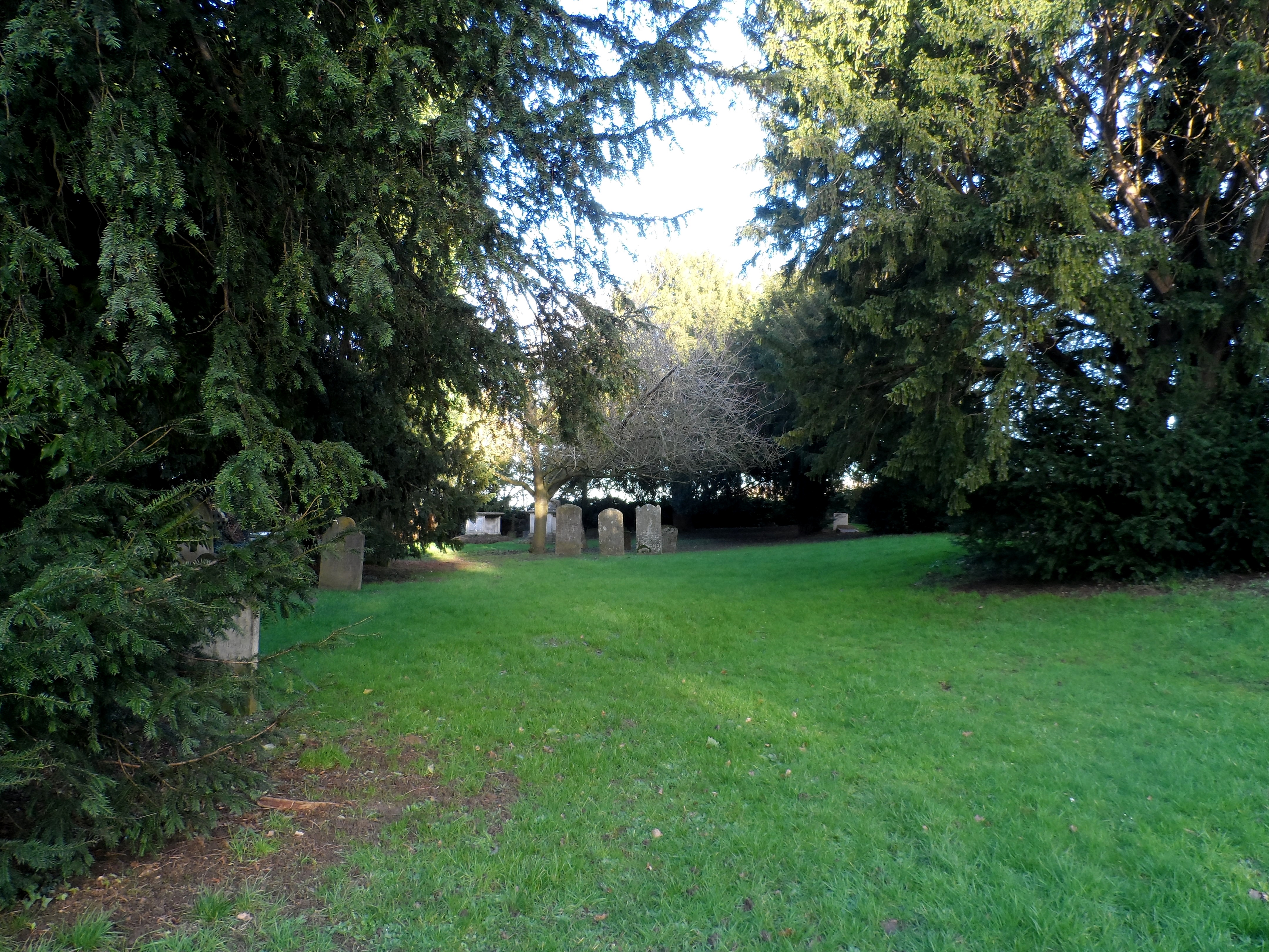 Part of the churchyard, which remains in use as a cemetery