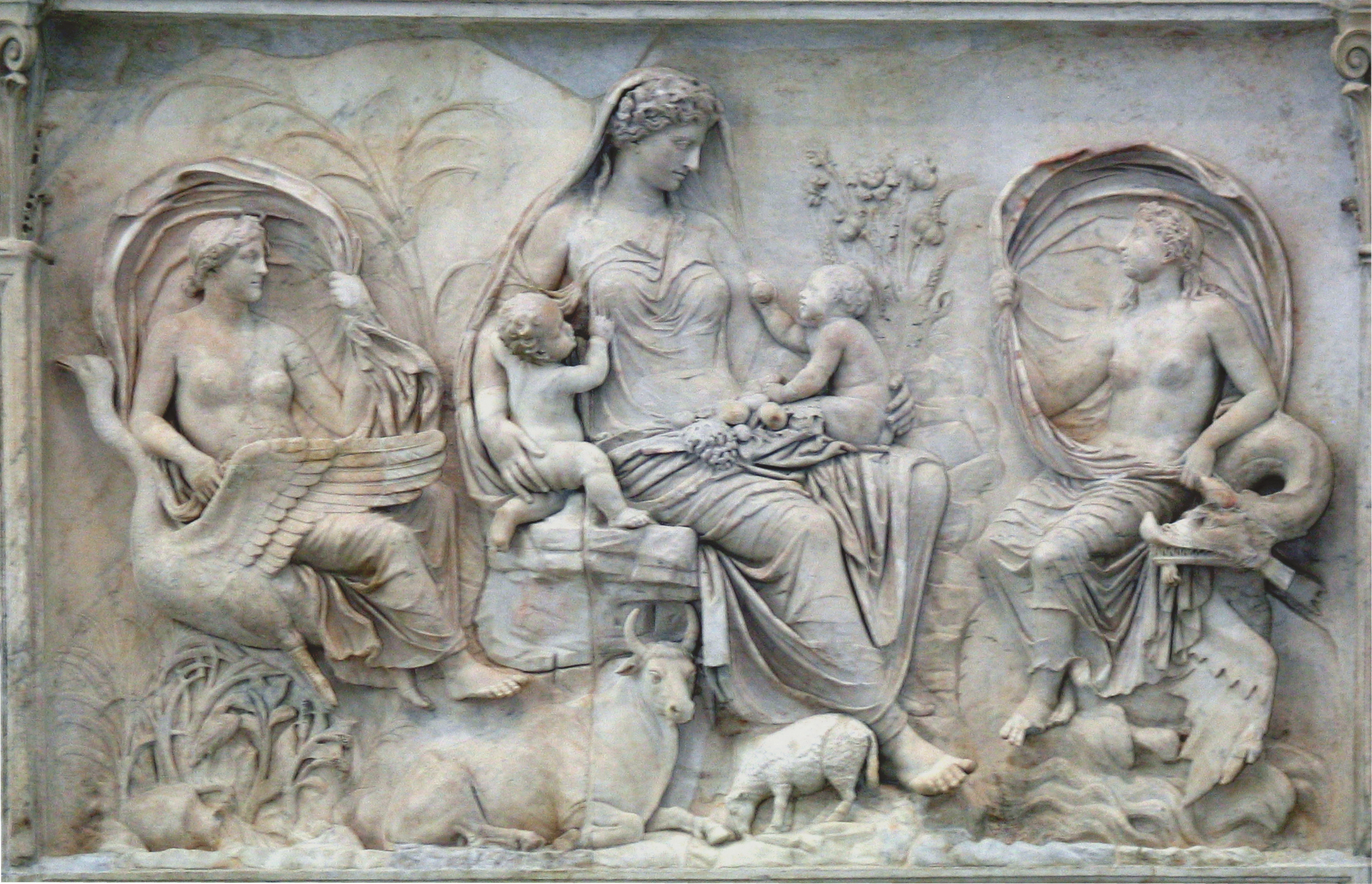 Tellus, chthonic mother of the fruitful earth, flanked by Venus (left) and Ceres. From the Augustan Ara Pacis, consecrated in 9 BC.