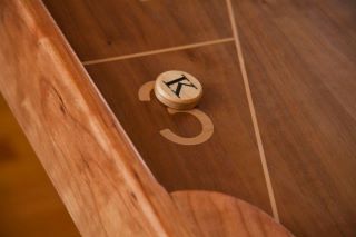A custom Kineti-Go Magnetic Shuffleboard with a magnetic maple puck