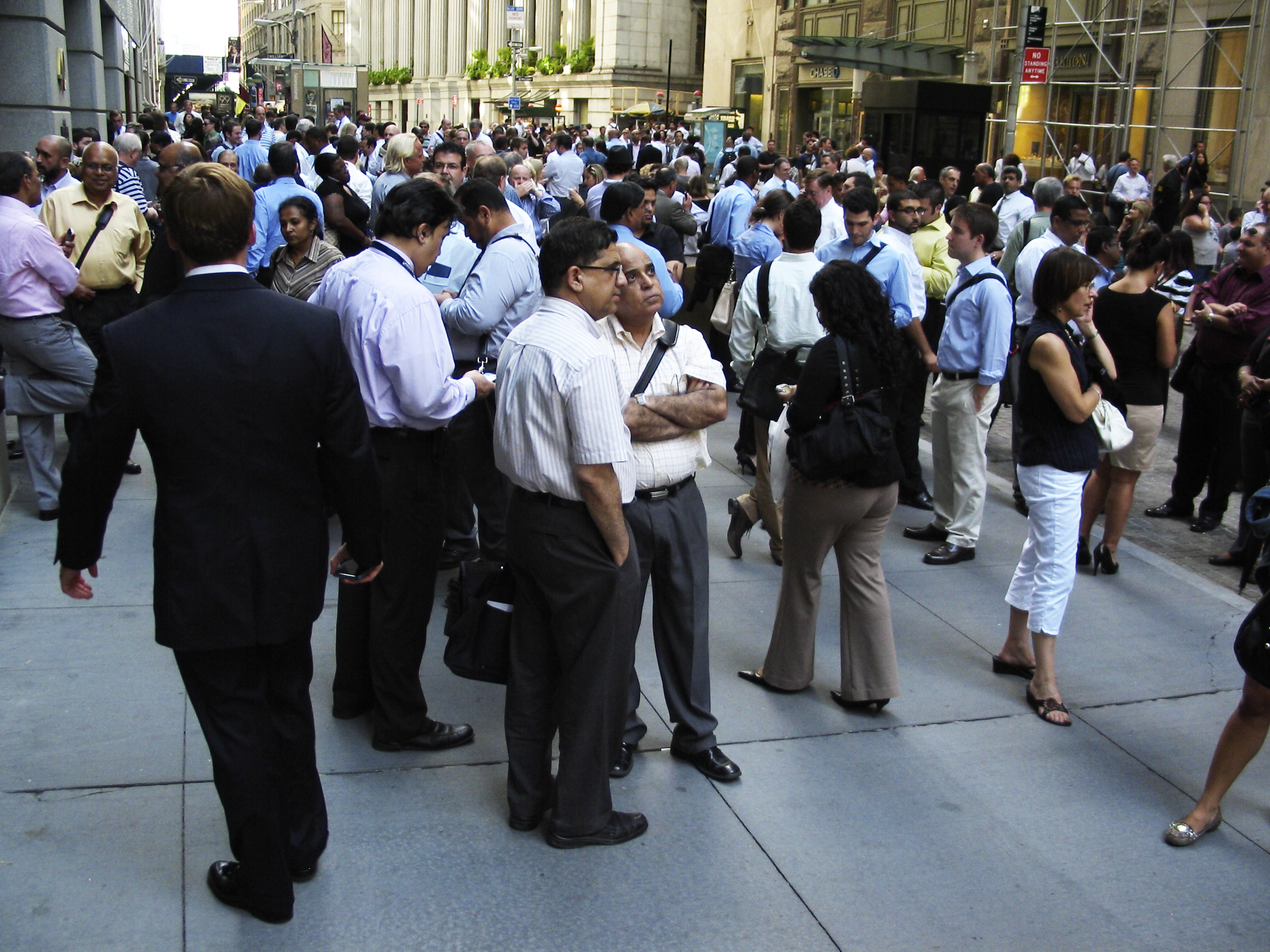 People gather outside 40 Wall Street in New York City after the earthquake.