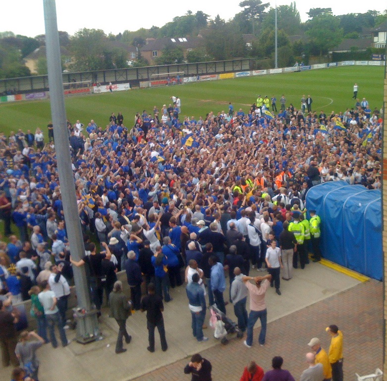 AFC Wimbledon fans and players celebrating promotion to the Conference South having beaten Staines Town 2–1 in the Isthmian League Premier Division Play-off Final at the end of the 2007–08 season. AFC Wimbledon fans and players celebrating promotion to the Conference South having beaten Staines Town 2–1 in the Isthmian League Premier Division Play-off Final at the end of the 2007–08 season.
