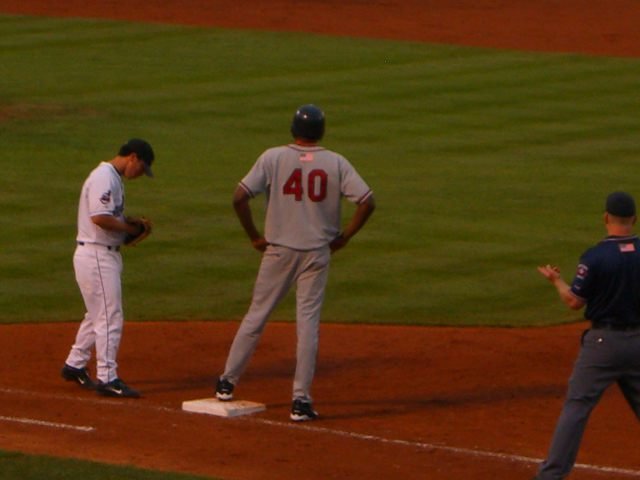 Guerrero (standing on first base) as a member of the Harrisburg Senators in a 2005 Eastern League baseball game in Canal Park against the Akron Aeros.